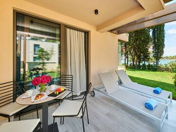 a patio with chairs and a table