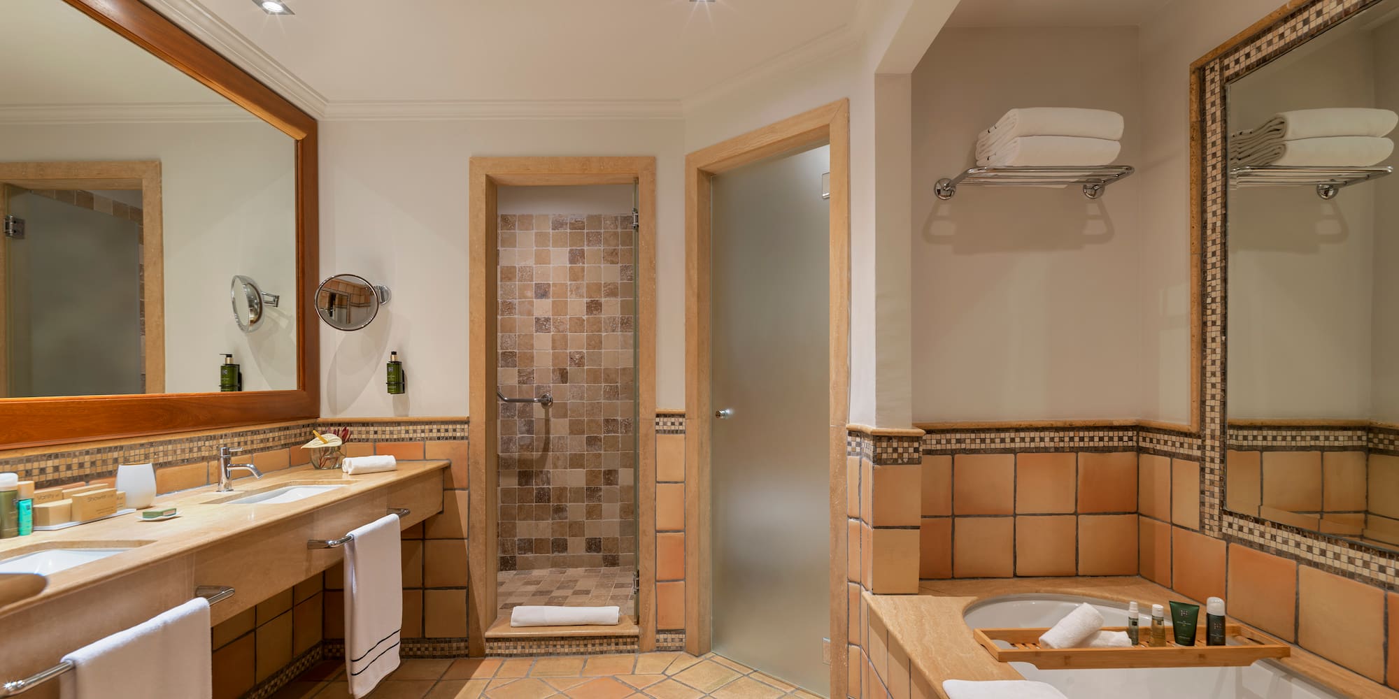 a bathroom with a tub and a shower