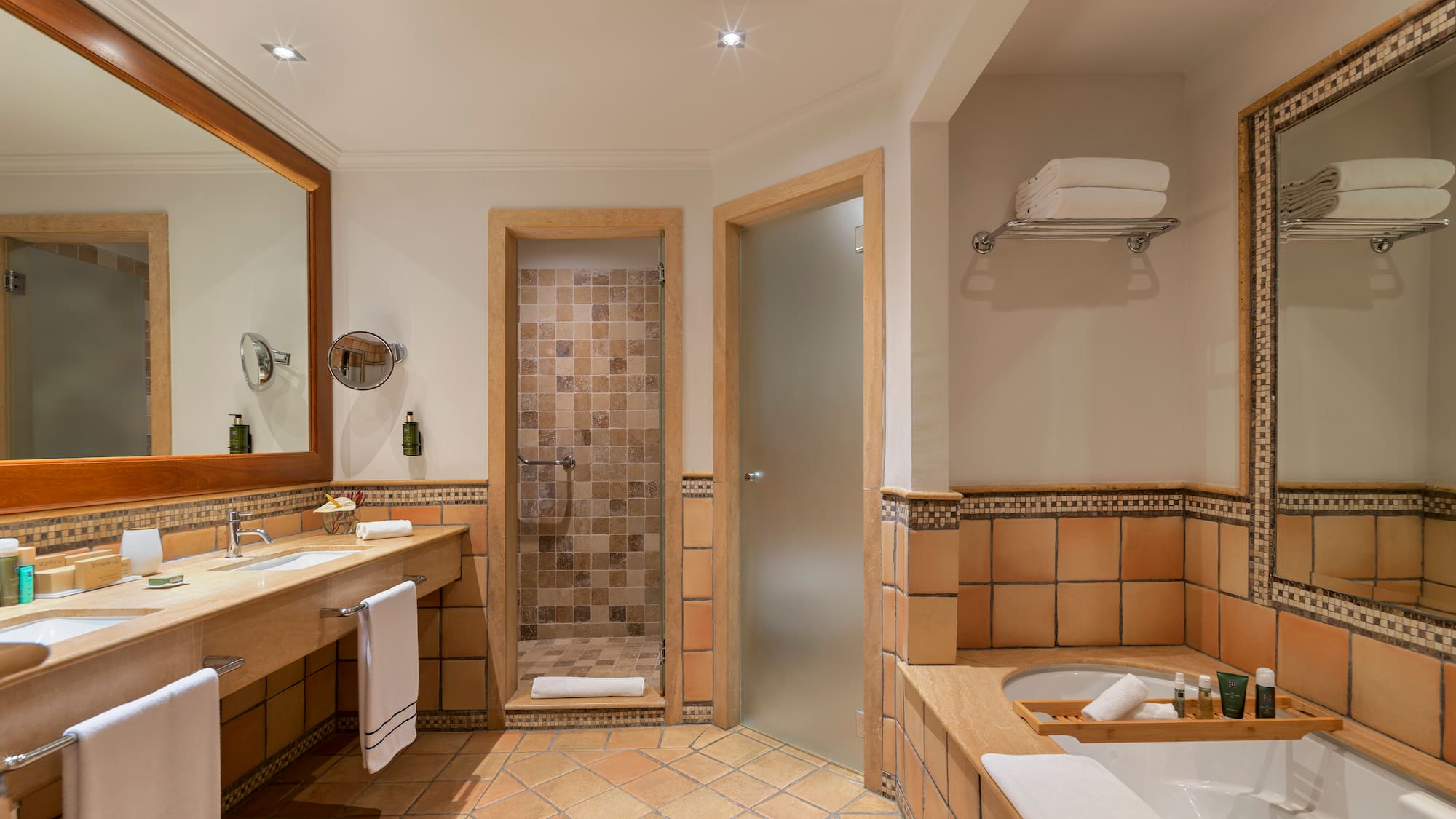 a bathroom with a tub and a shower