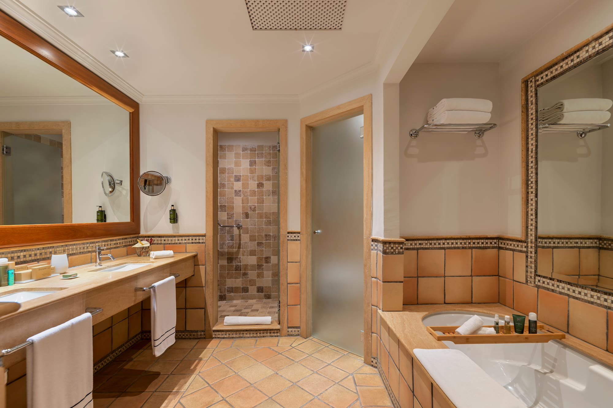 a bathroom with a tub and a shower