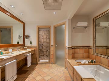 a bathroom with a tub and a shower