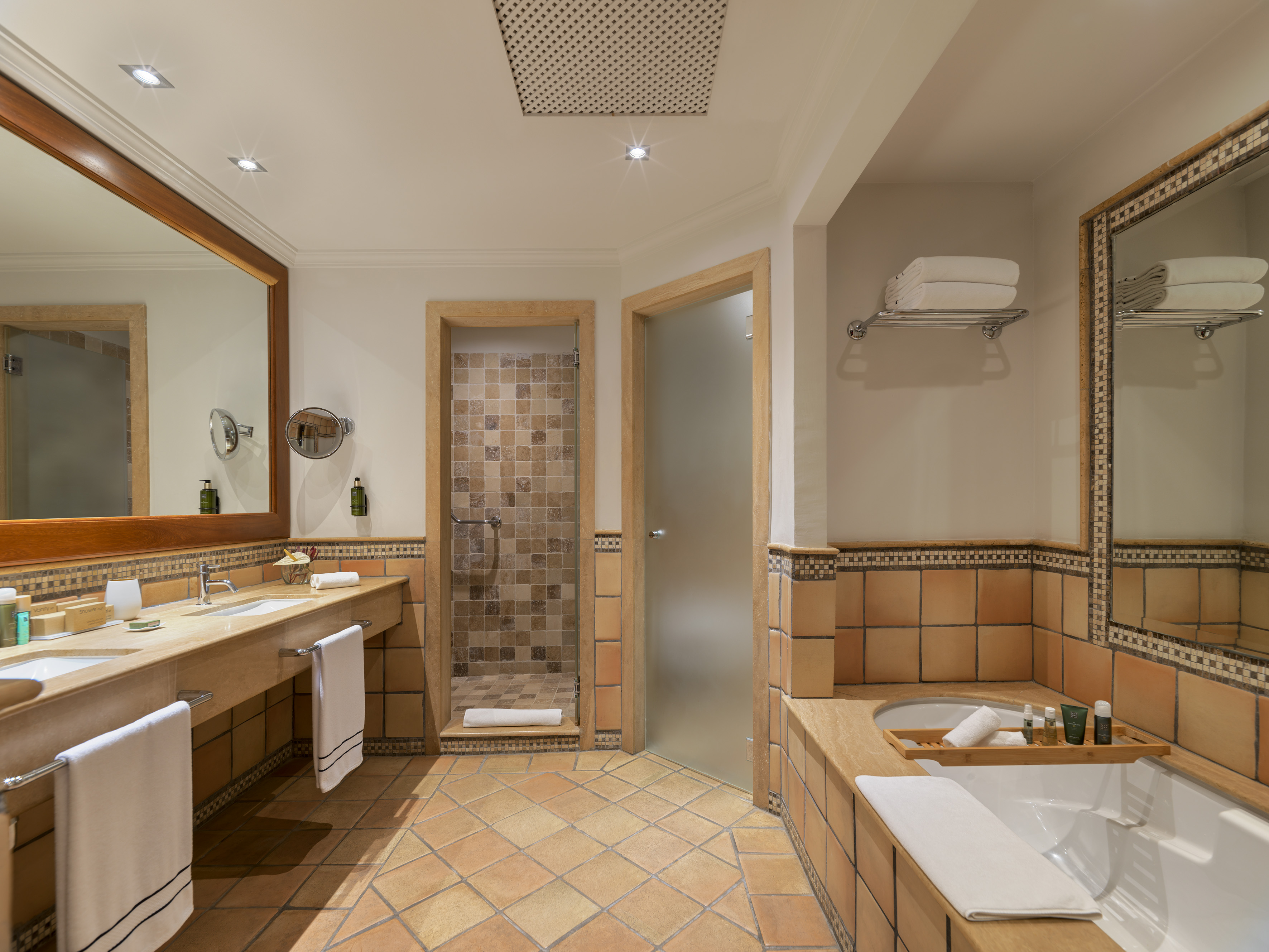 a bathroom with a tub and a shower