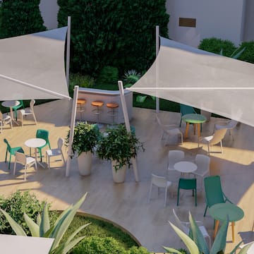 a patio with tables and chairs