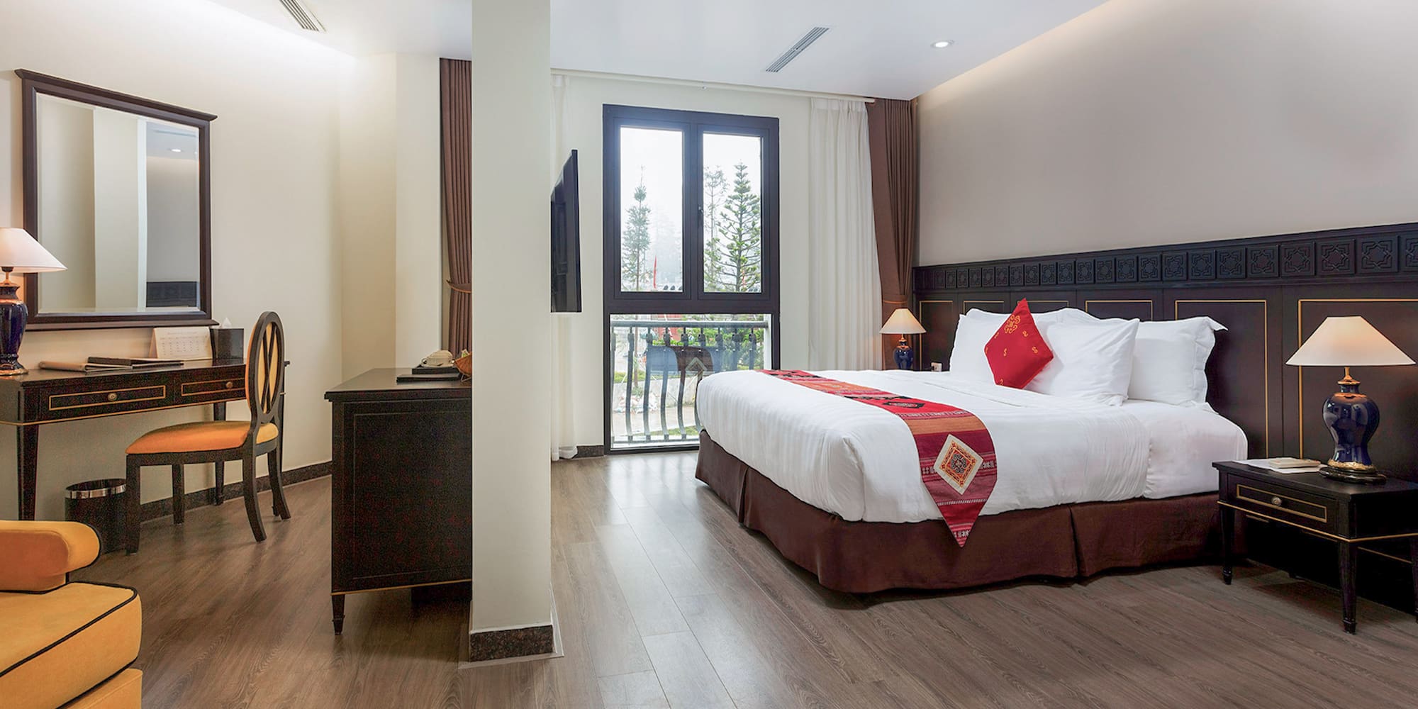 a bedroom with a bed and a desk