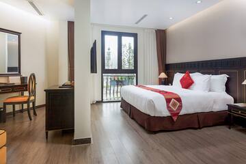 a bedroom with a bed and a desk