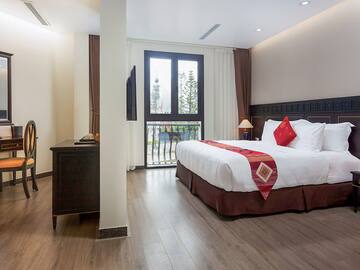 a bedroom with a bed and a desk