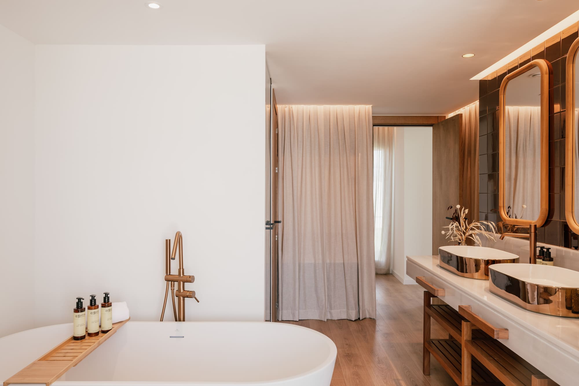 a bathroom with a tub and sink
