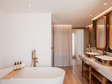 a bathroom with a tub and sink