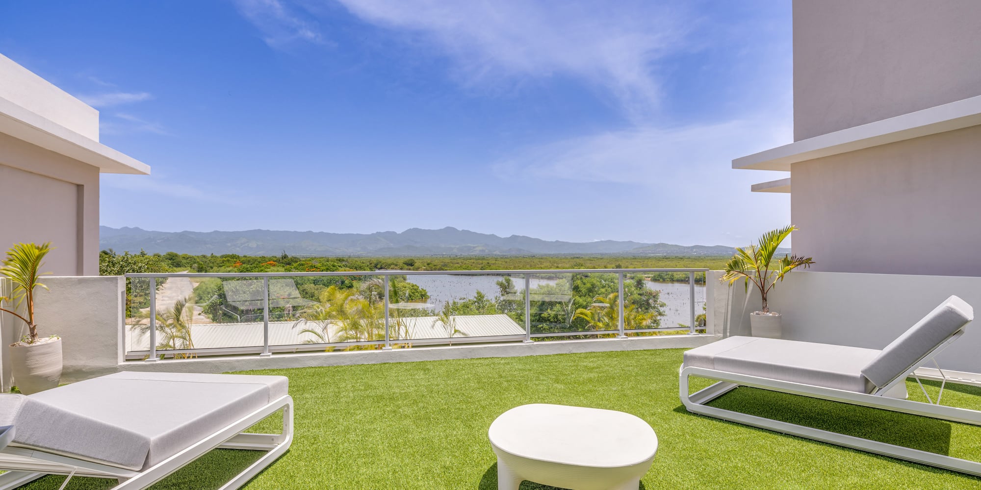 a white chairs on a green lawn