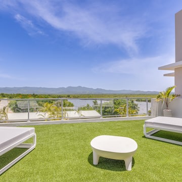 a white chairs on a green lawn