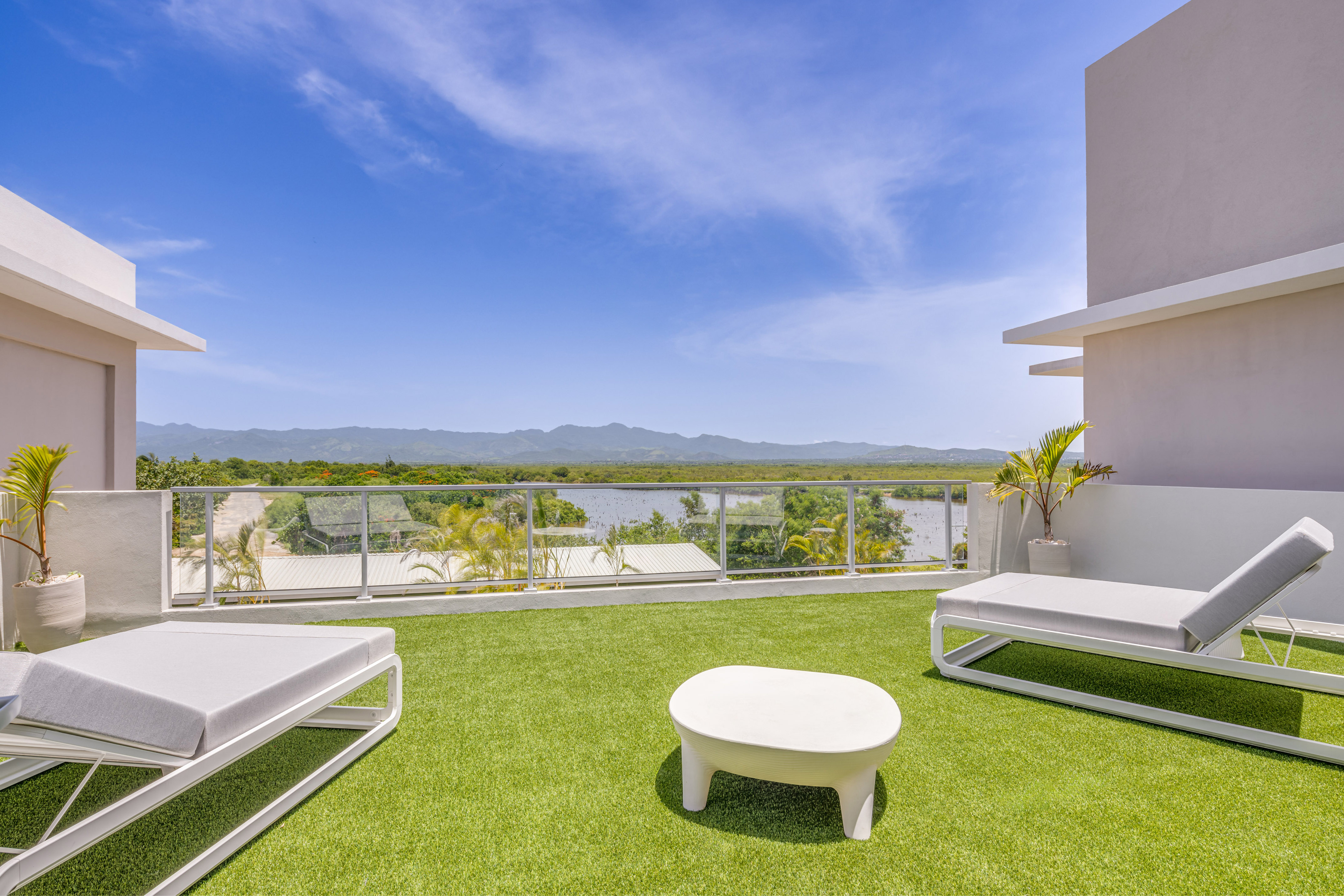 a white chairs on a green lawn