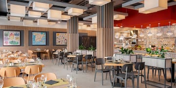 a restaurant with tables and chairs