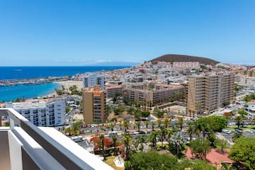 a city with a beach and trees