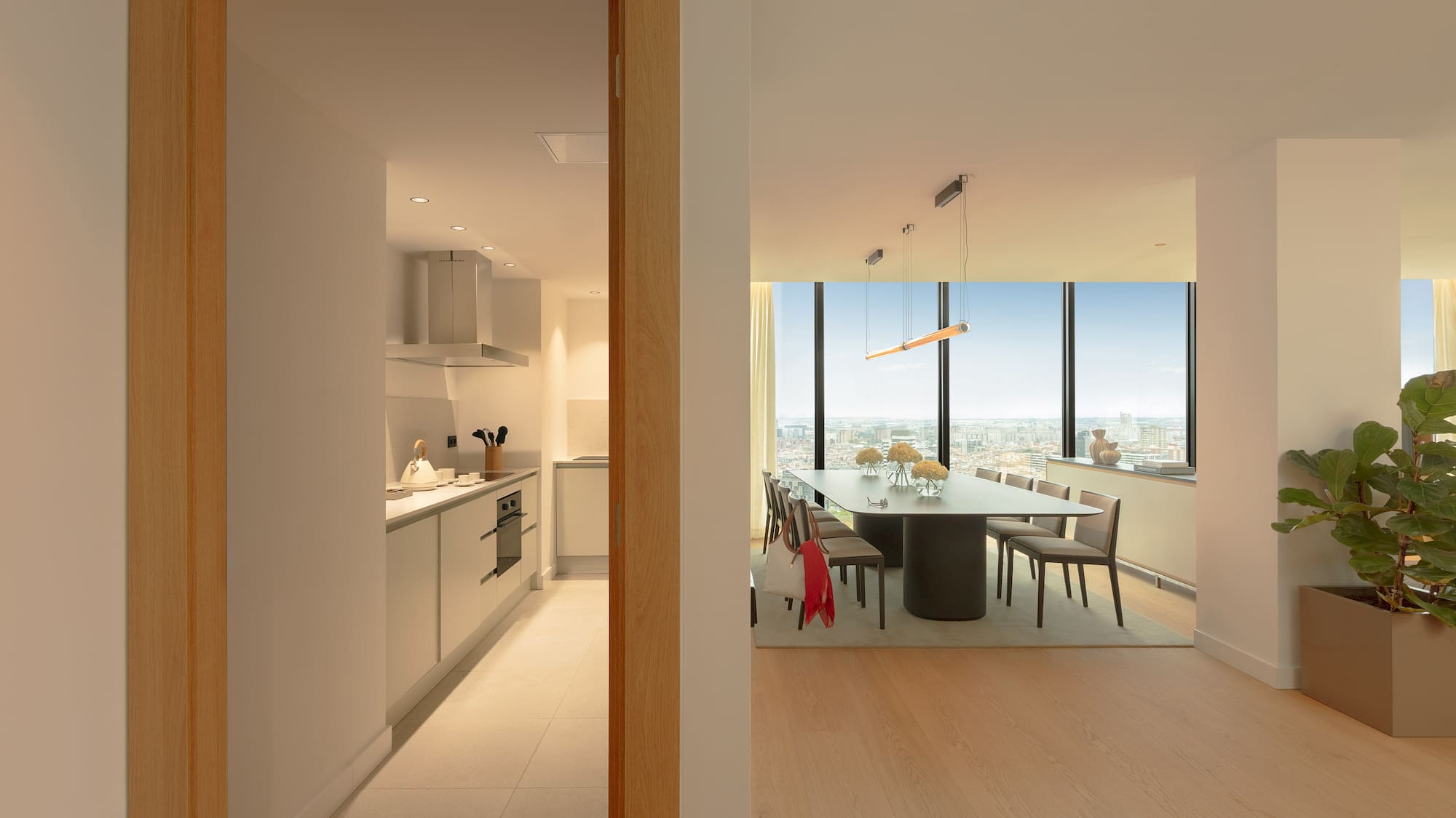 Modern high-rise apartment: open-plan dining room with city view, sleek kitchen.