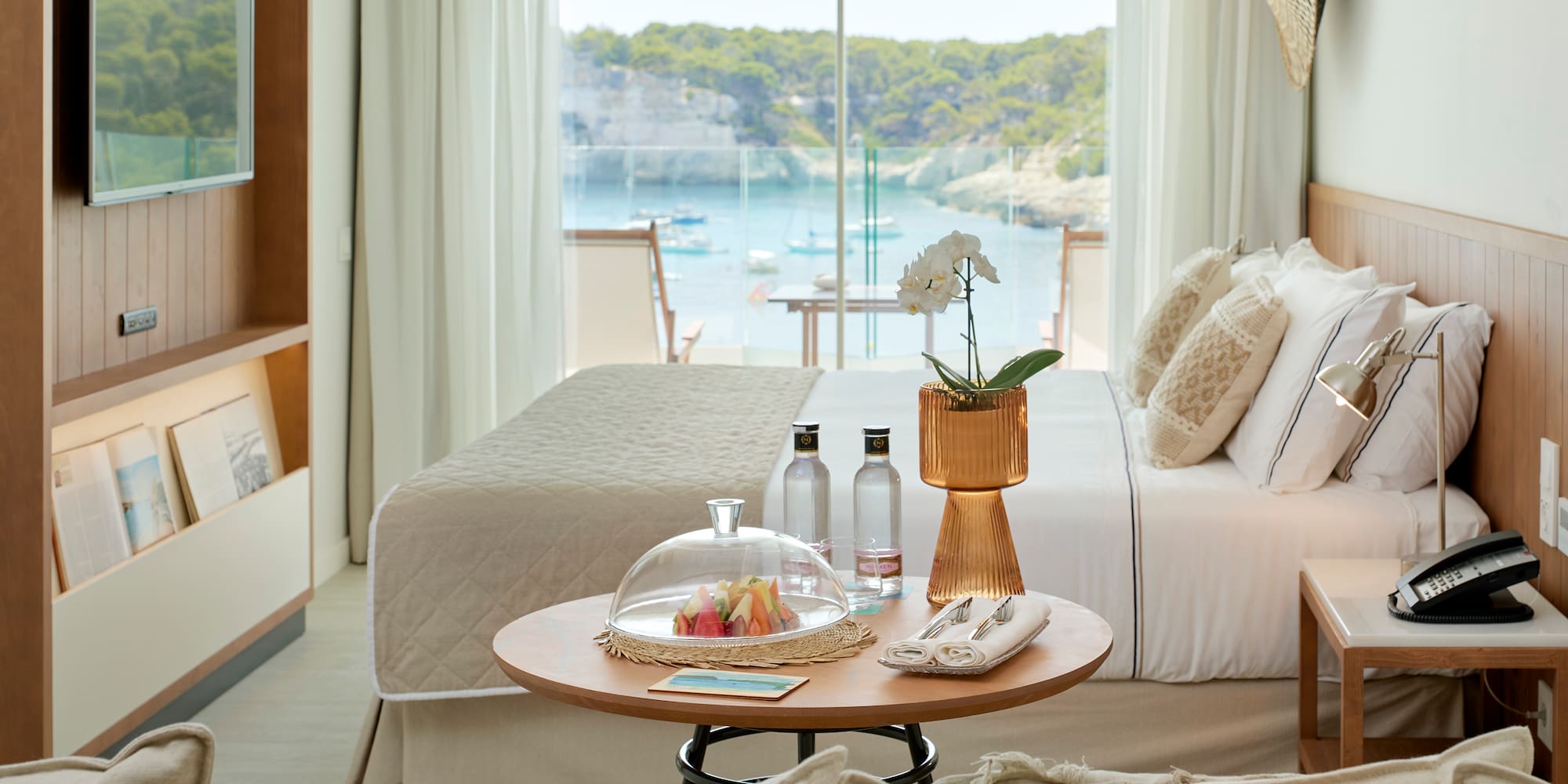 a room with a bed and a glass cover