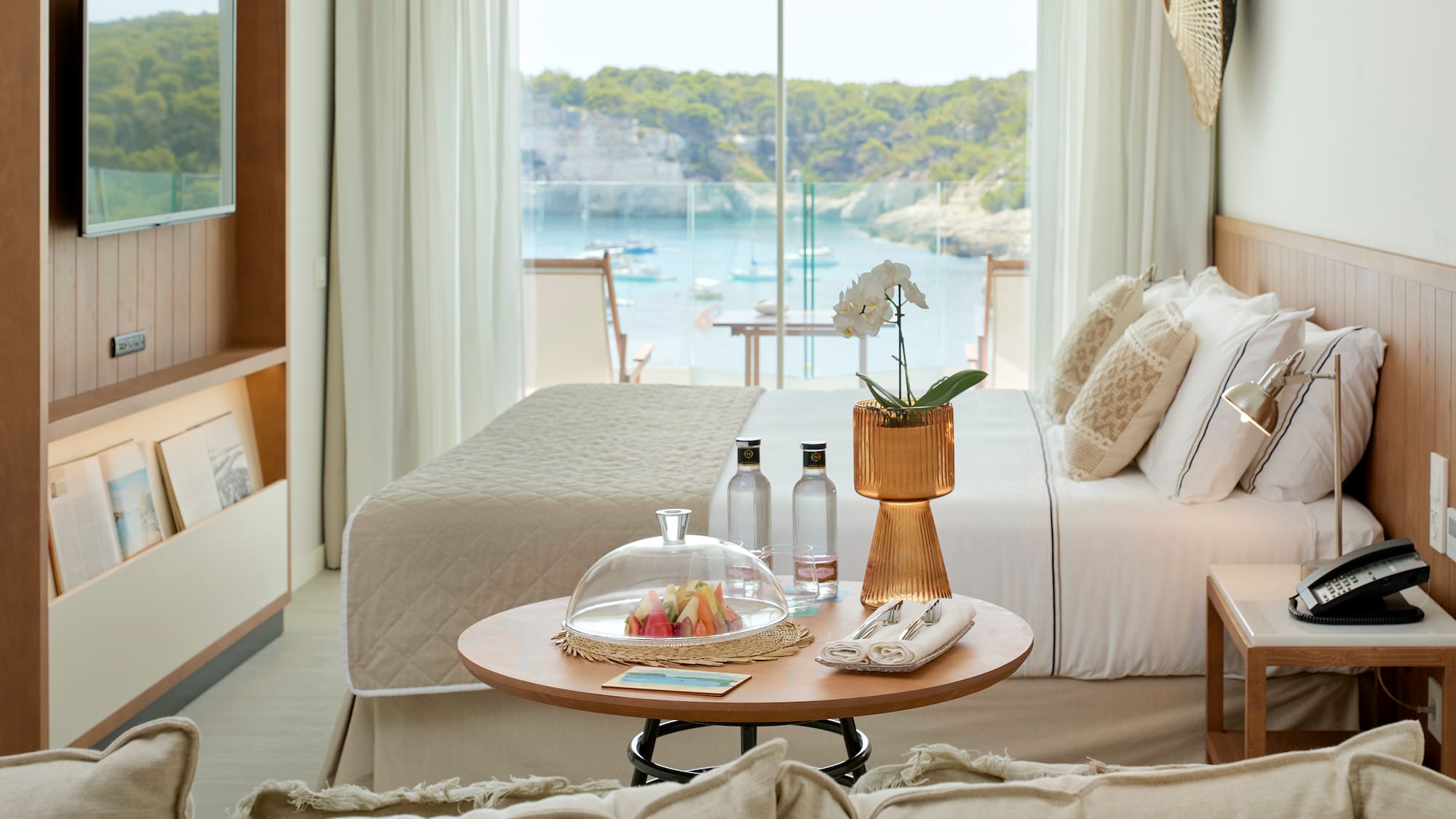 a room with a bed and a glass cover