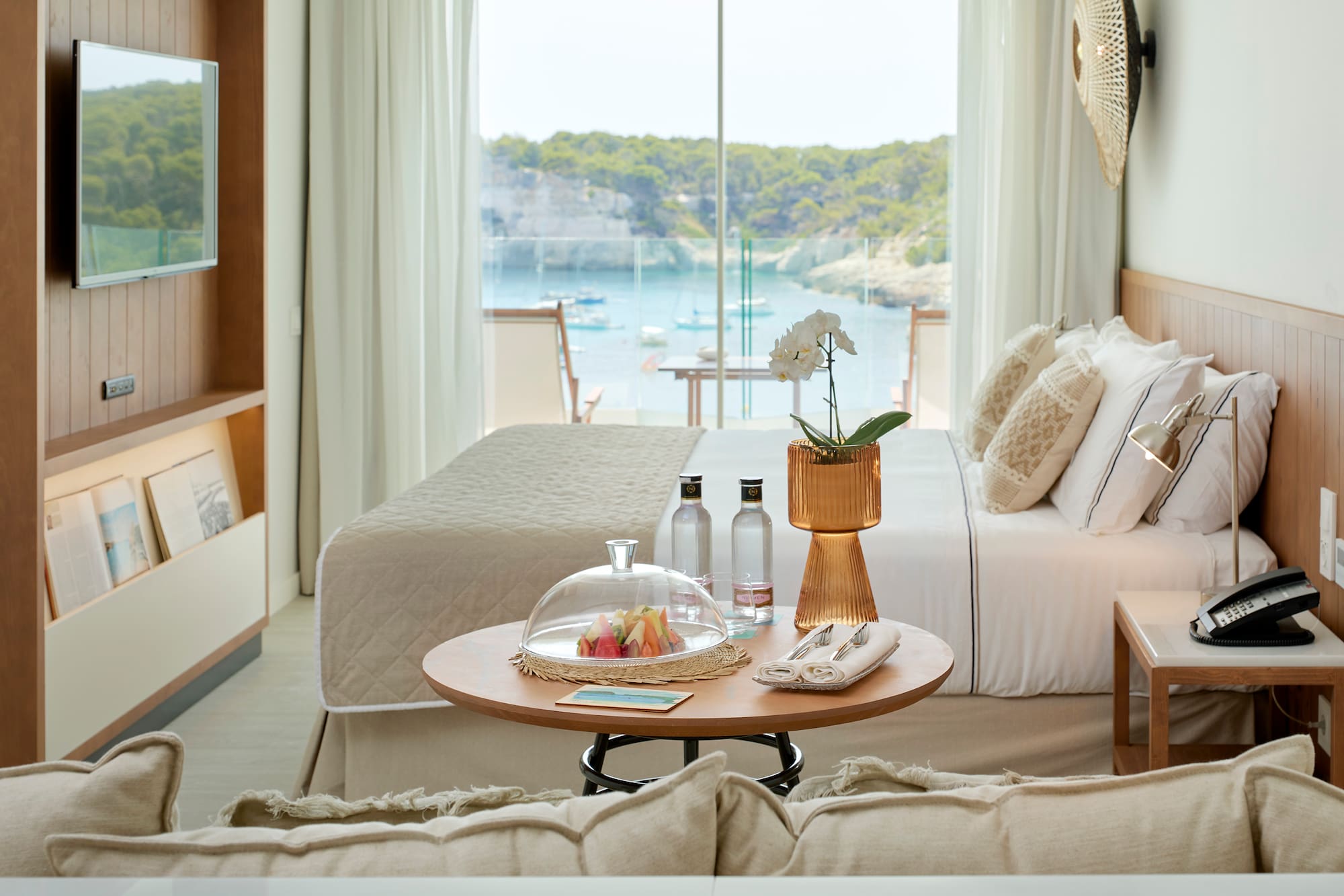 a room with a bed and a glass cover