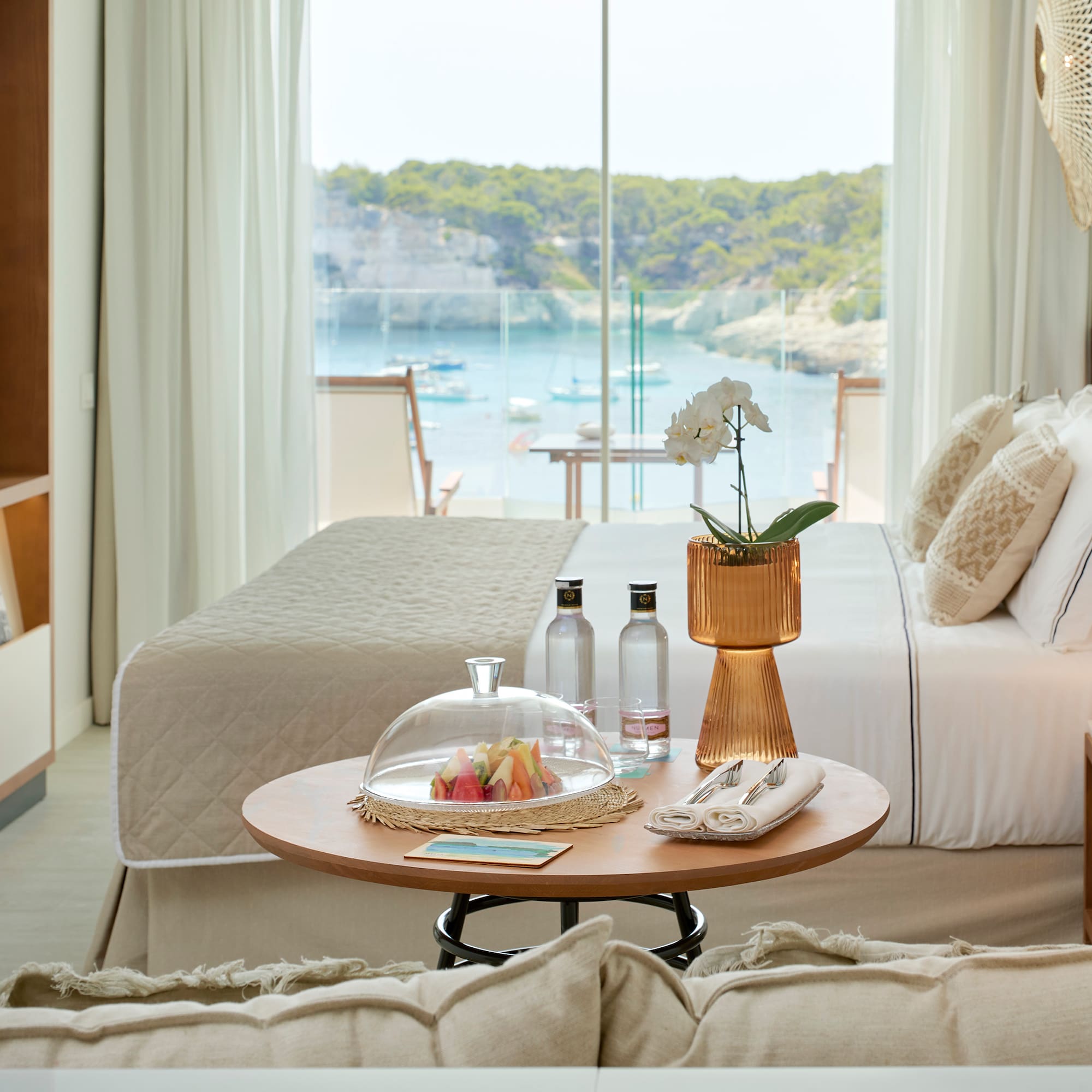 a room with a bed and a glass cover