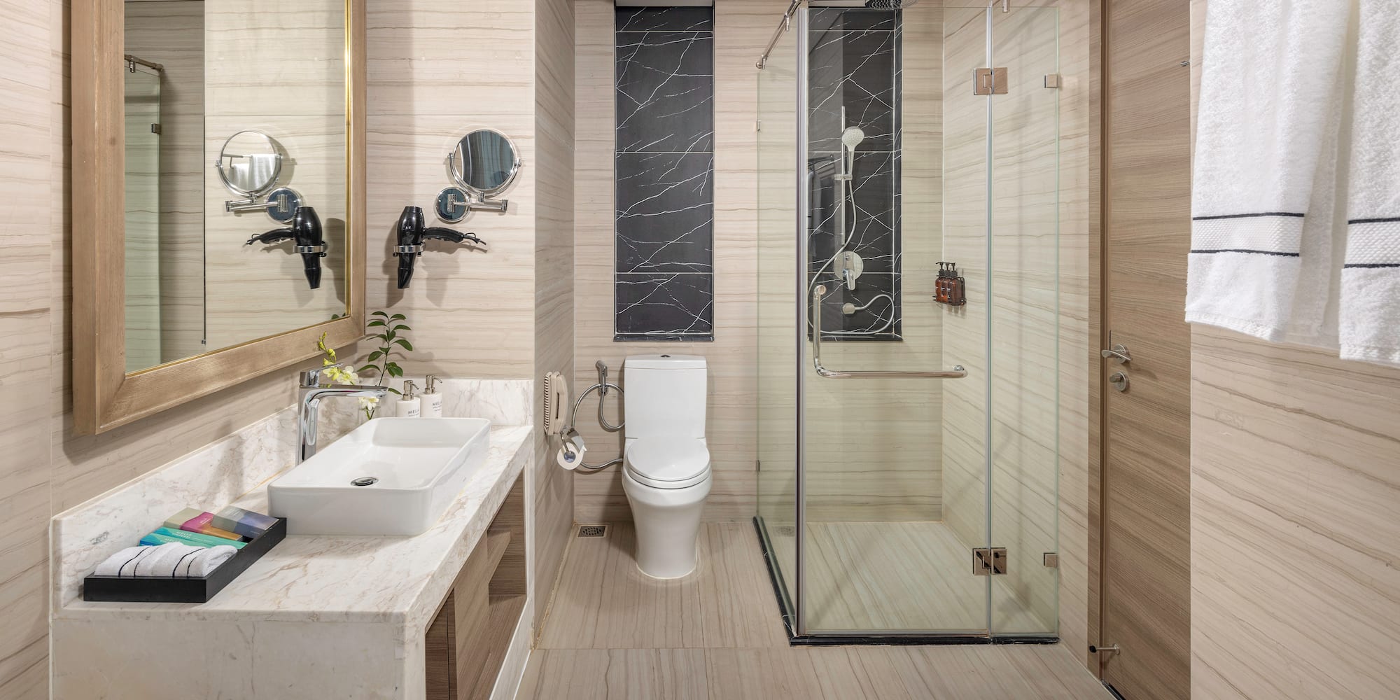 a bathroom with a glass shower and toilet