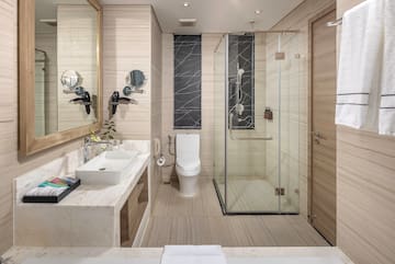 a bathroom with a glass shower and toilet
