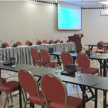 a room with tables and chairs