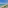 a beach with a clear blue water and a clear sky