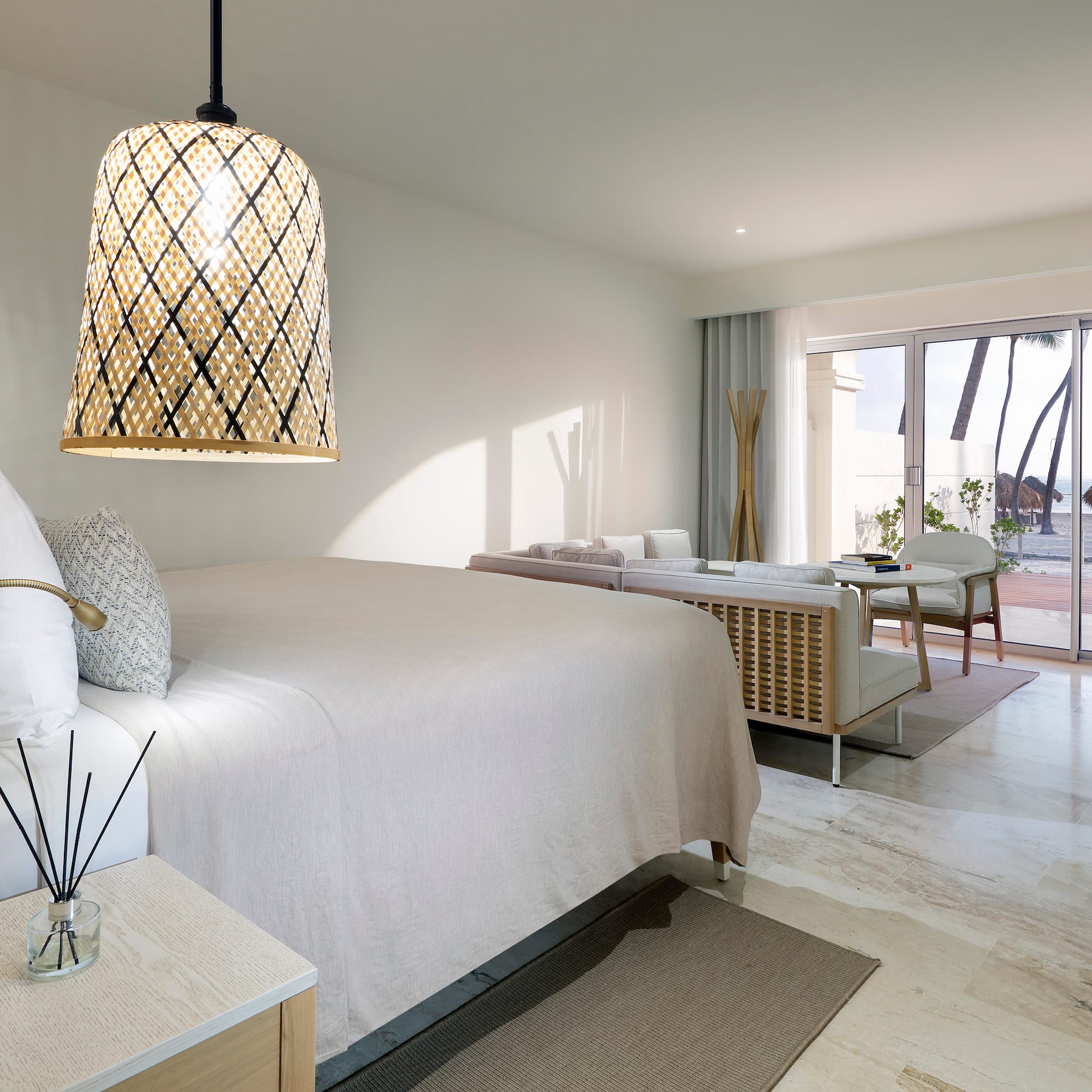 a bedroom with a bed and a table and chairs