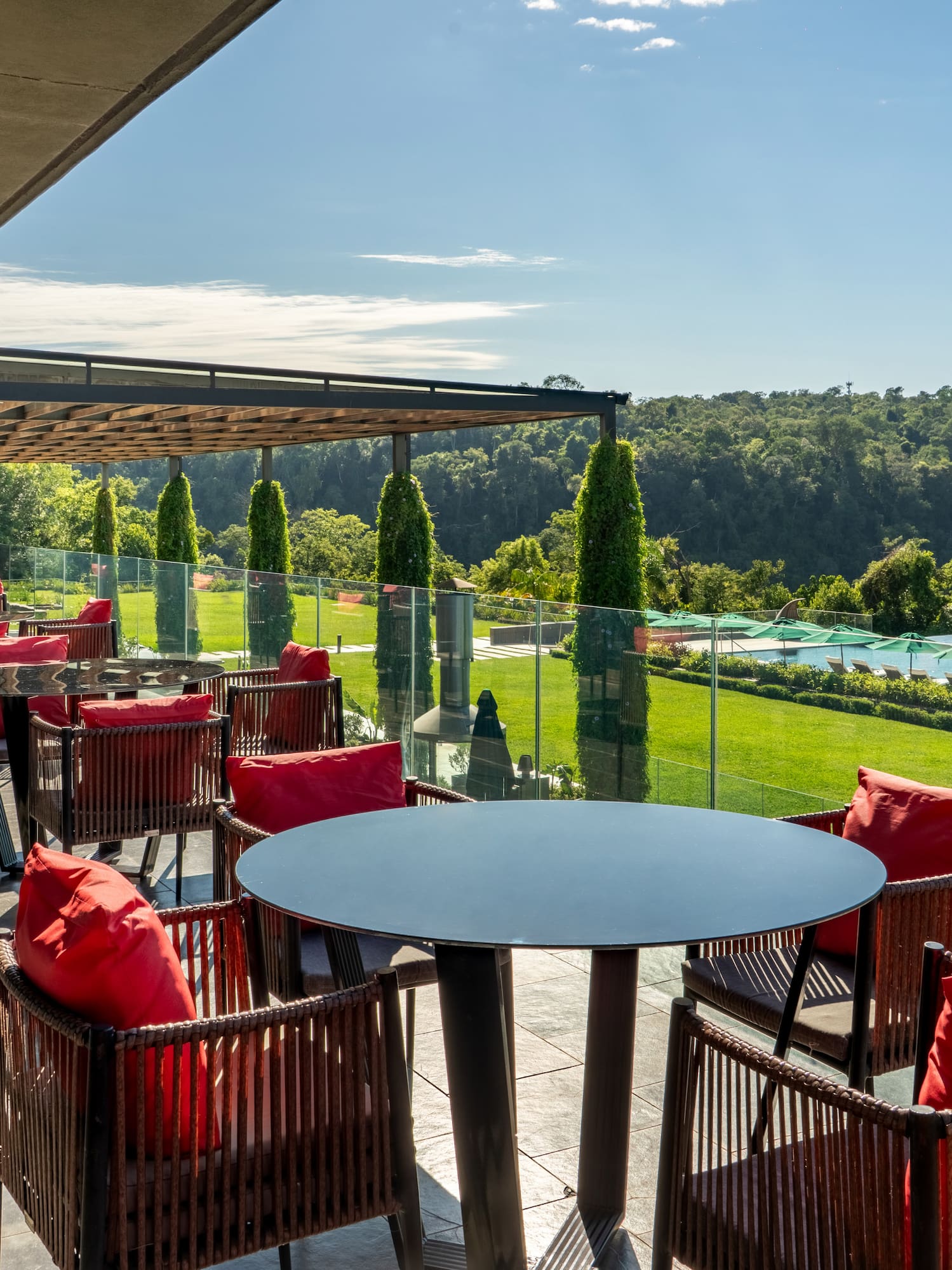 a patio with chairs and tables