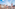 a group of people walking around a city