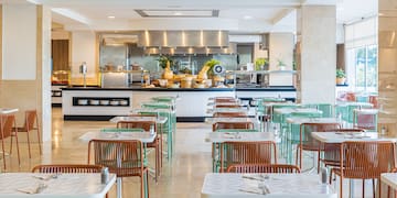 a restaurant with tables and chairs