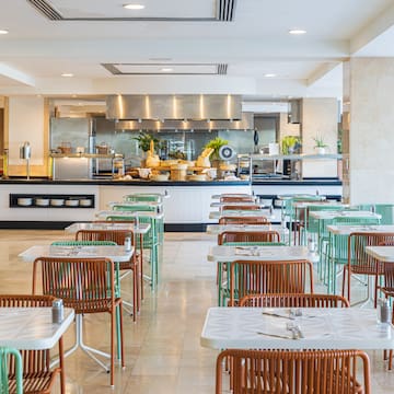 a restaurant with tables and chairs