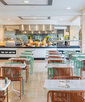 a restaurant with tables and chairs
