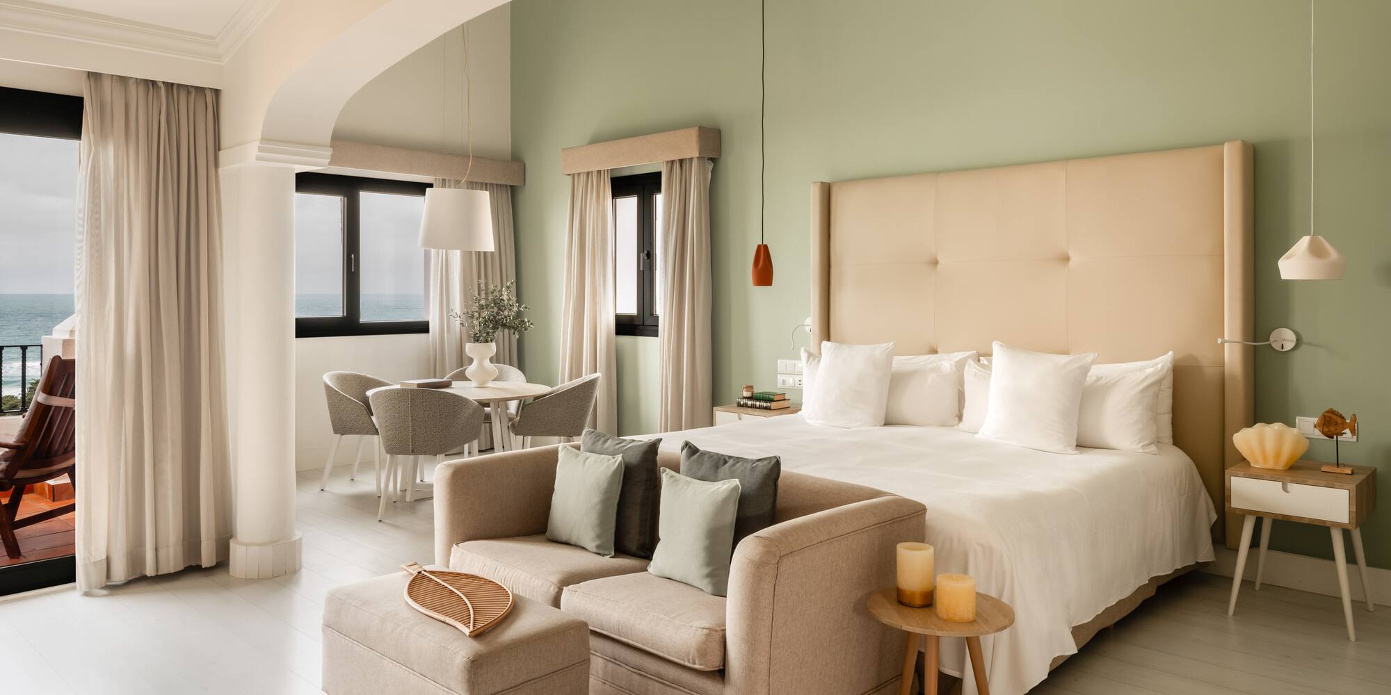 a bedroom with a bed and a couch