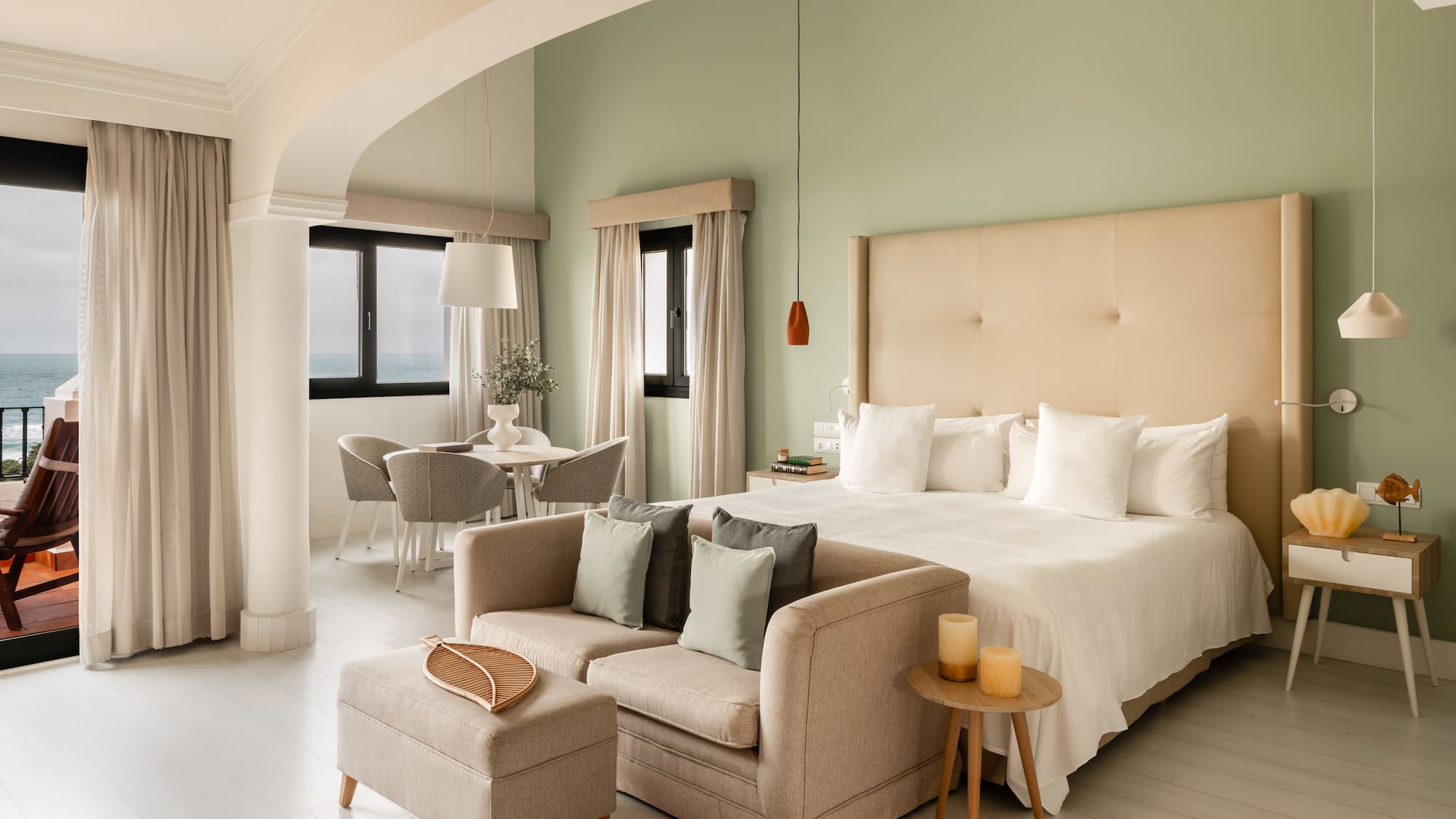 a bedroom with a bed and a couch