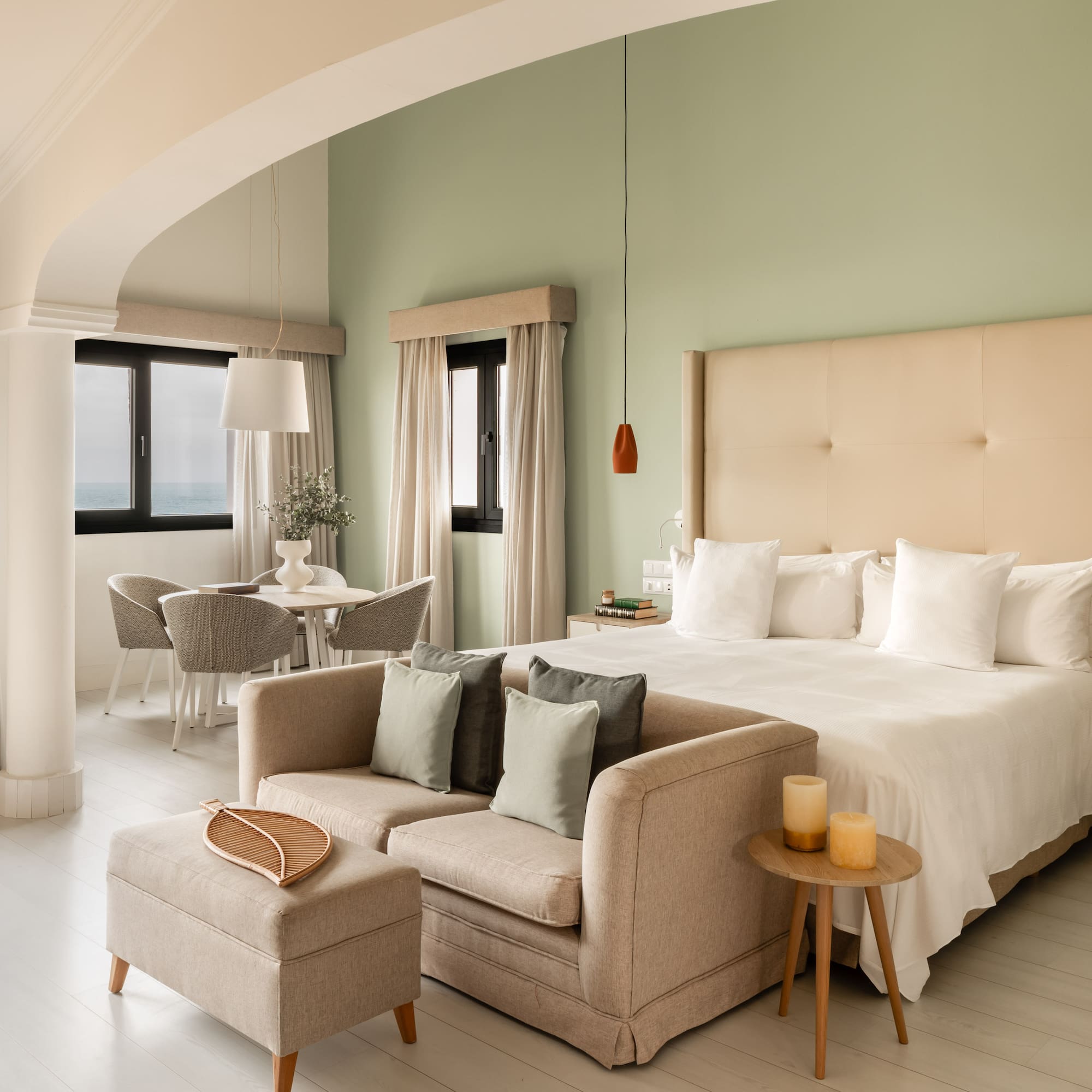 a bedroom with a bed and a couch