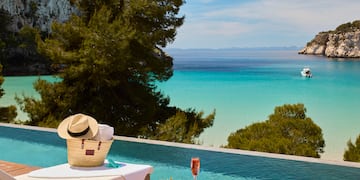 a pool with a table and a hat on it