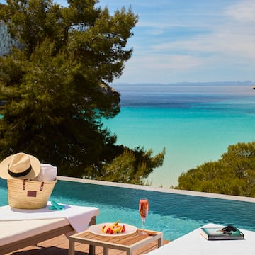 a pool with a table and a hat on it