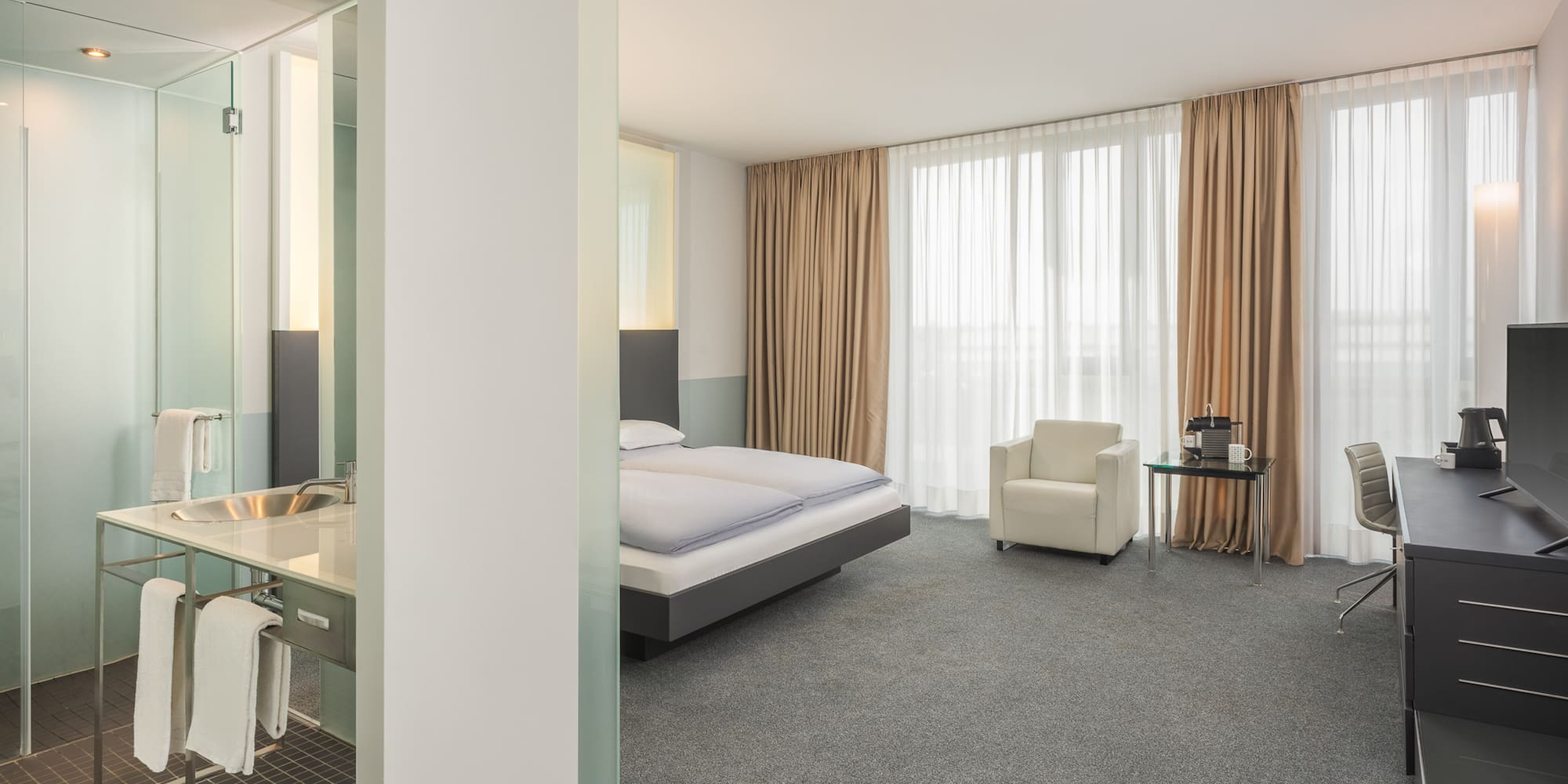 a room with a bed and a desk