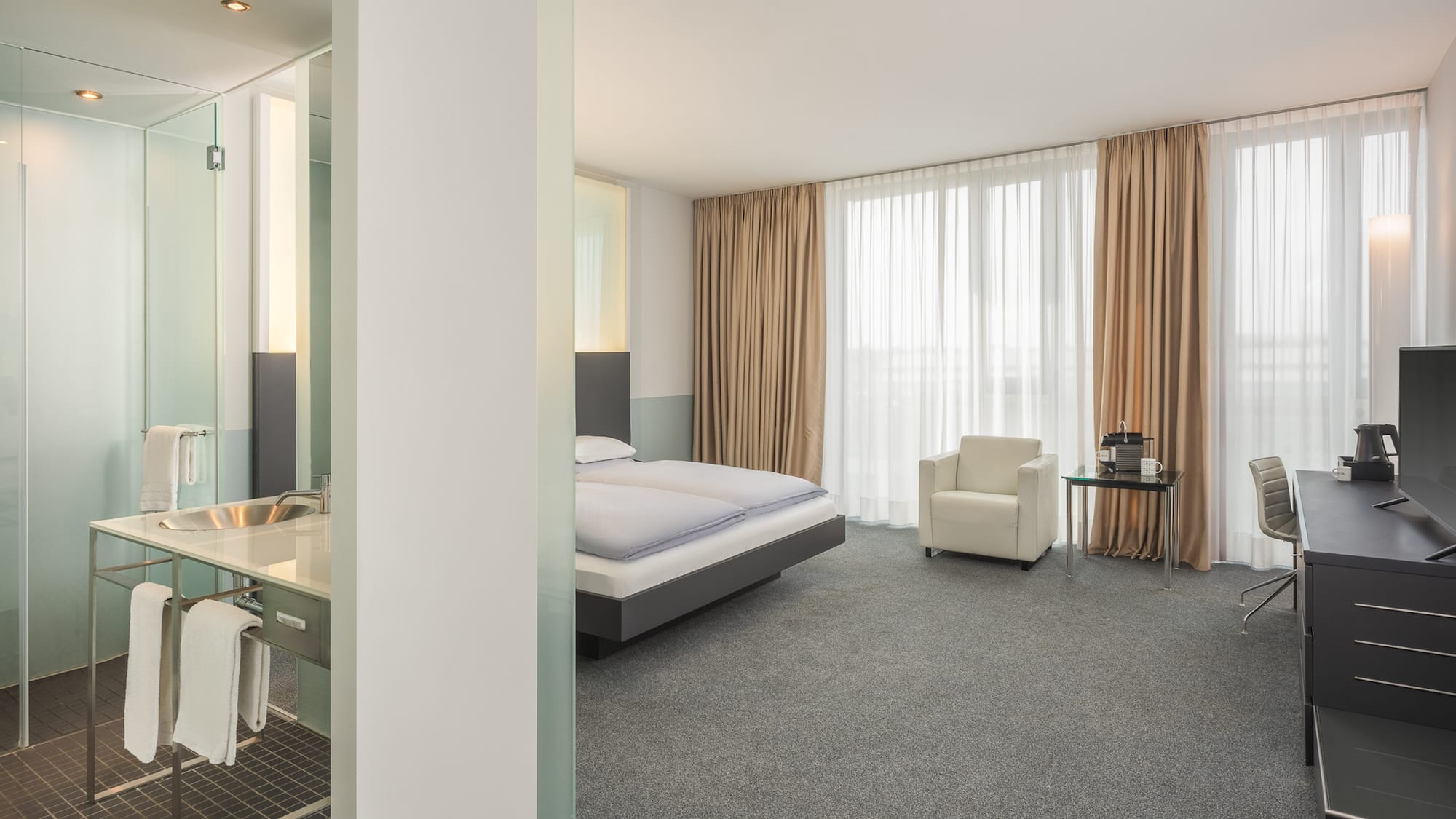 a room with a bed and a desk