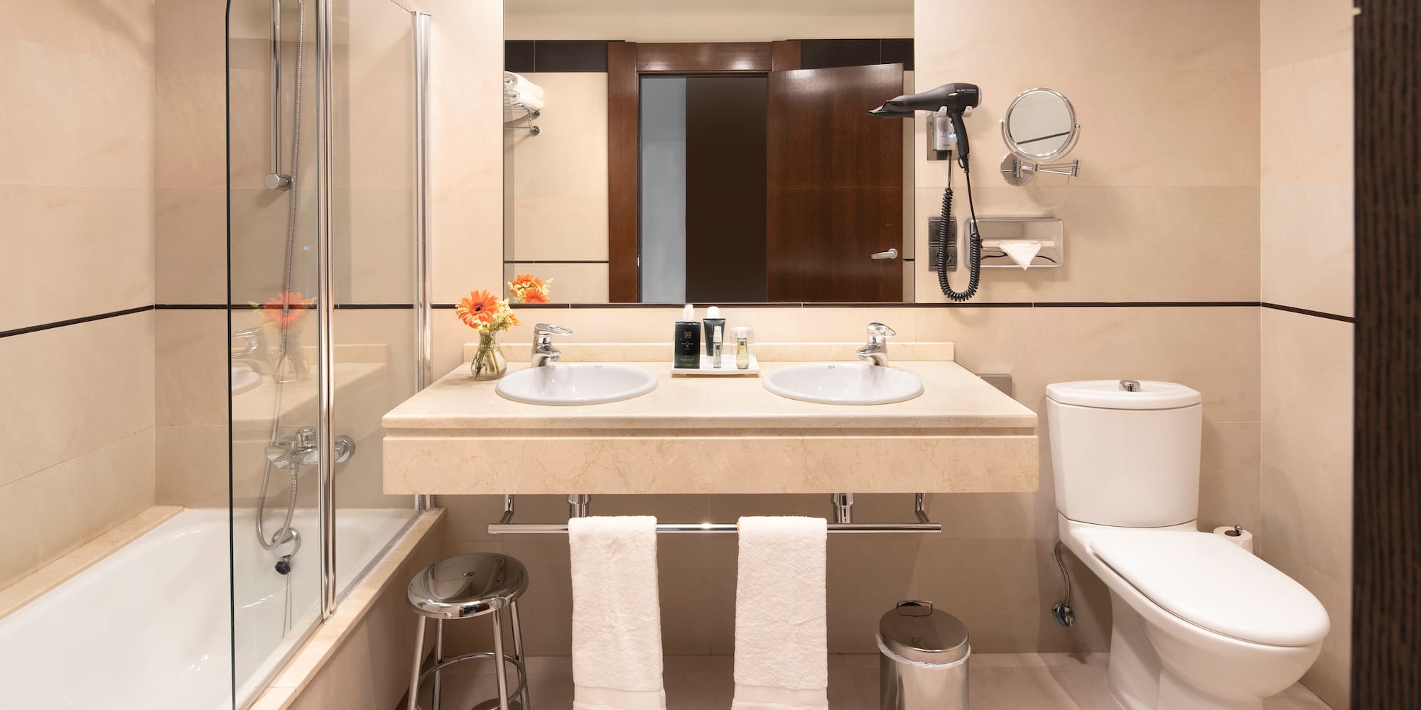 a bathroom with a shower and sink