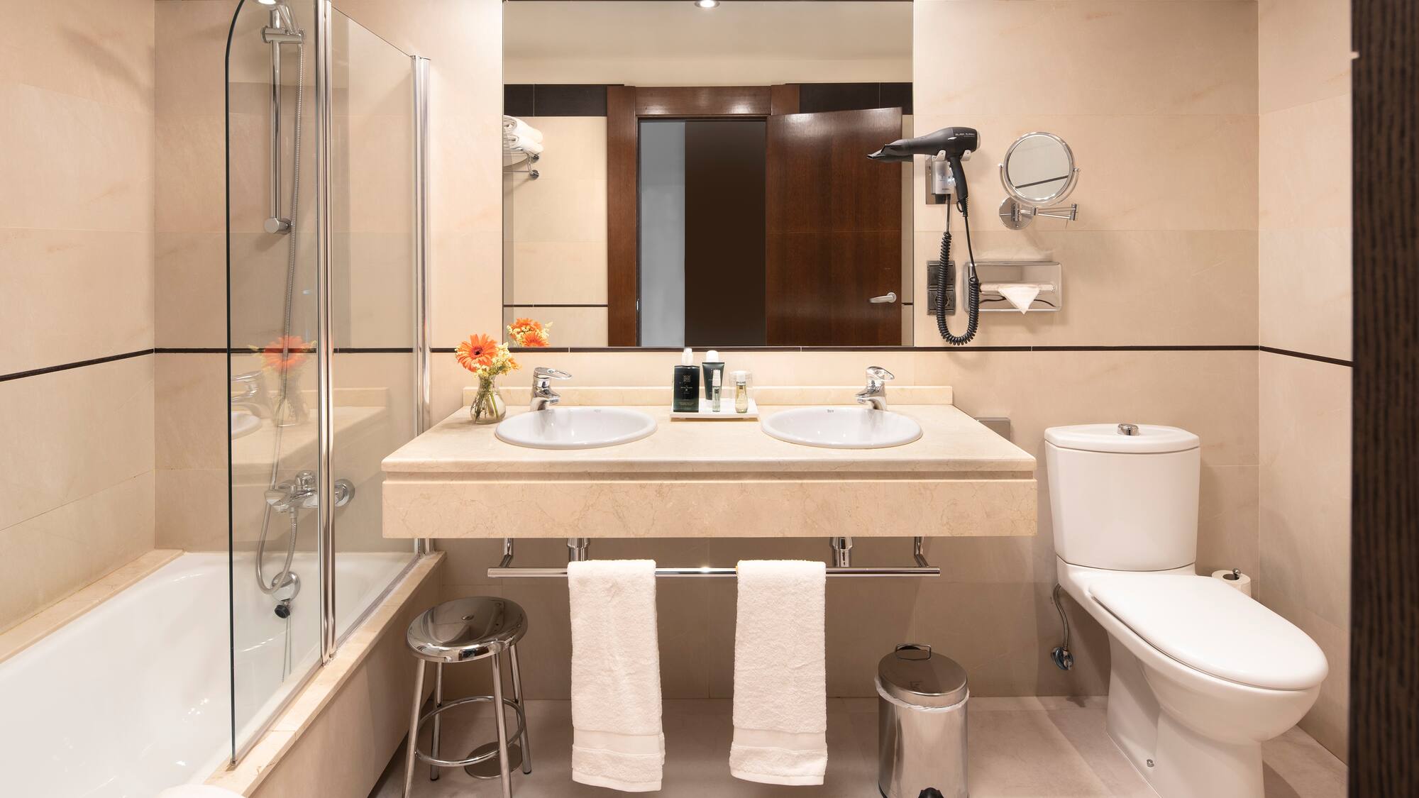 a bathroom with a shower and sink