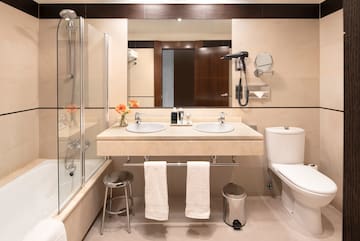 a bathroom with a shower and sink