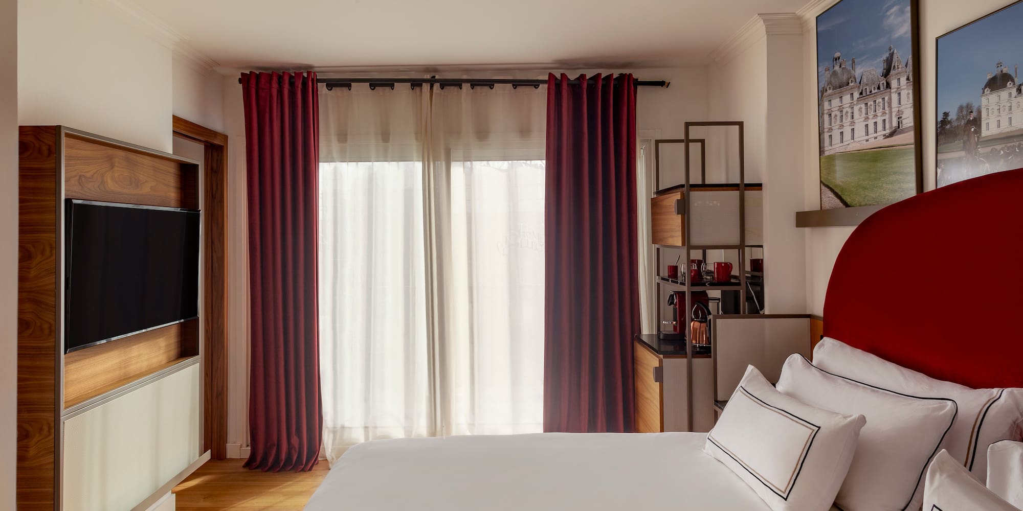 a bedroom with a bed and a television