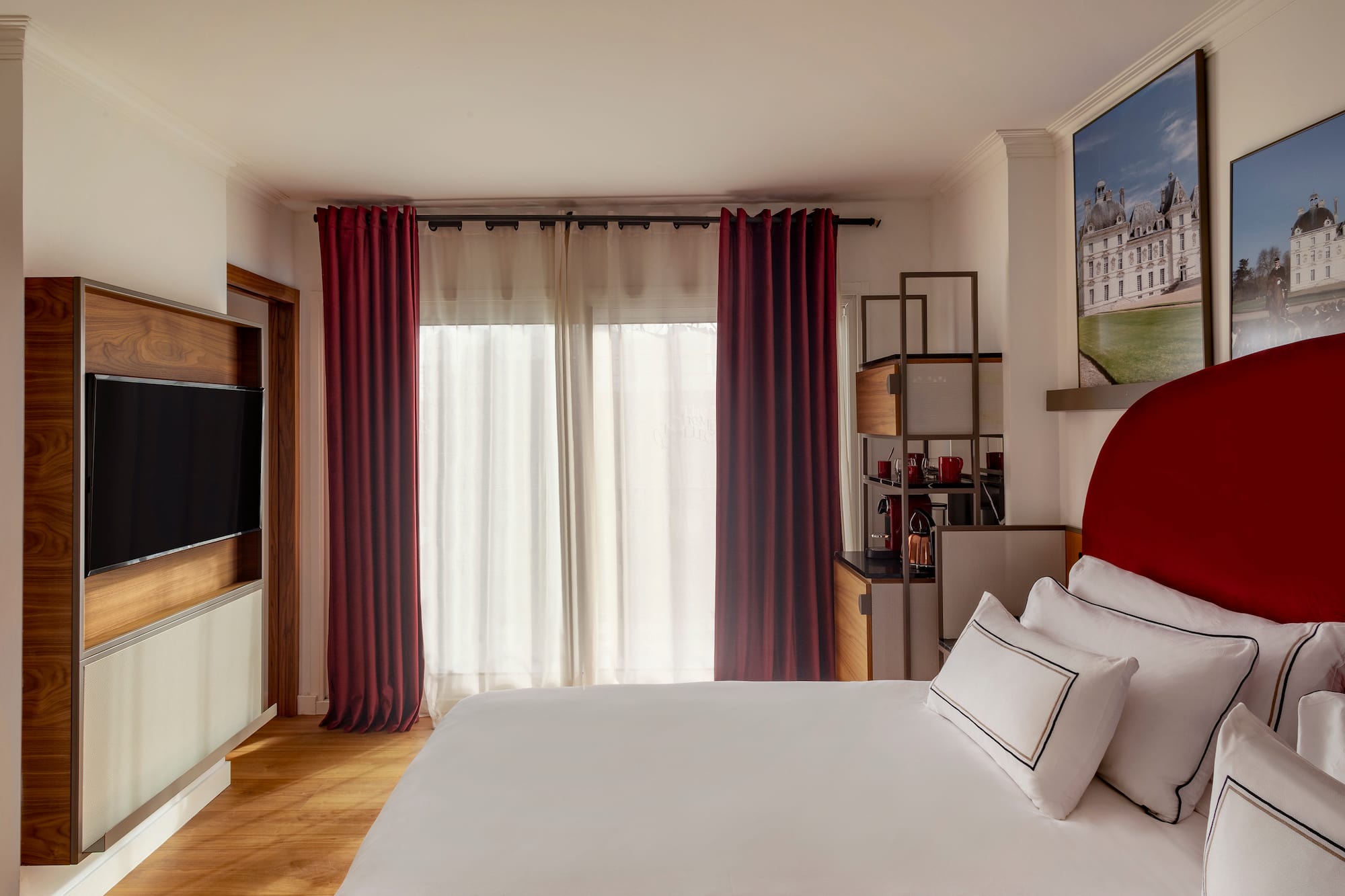 a bedroom with a bed and a television