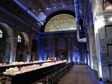 a long room with many tables and chairs