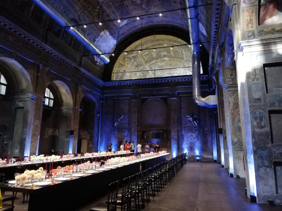 a long room with many tables and chairs