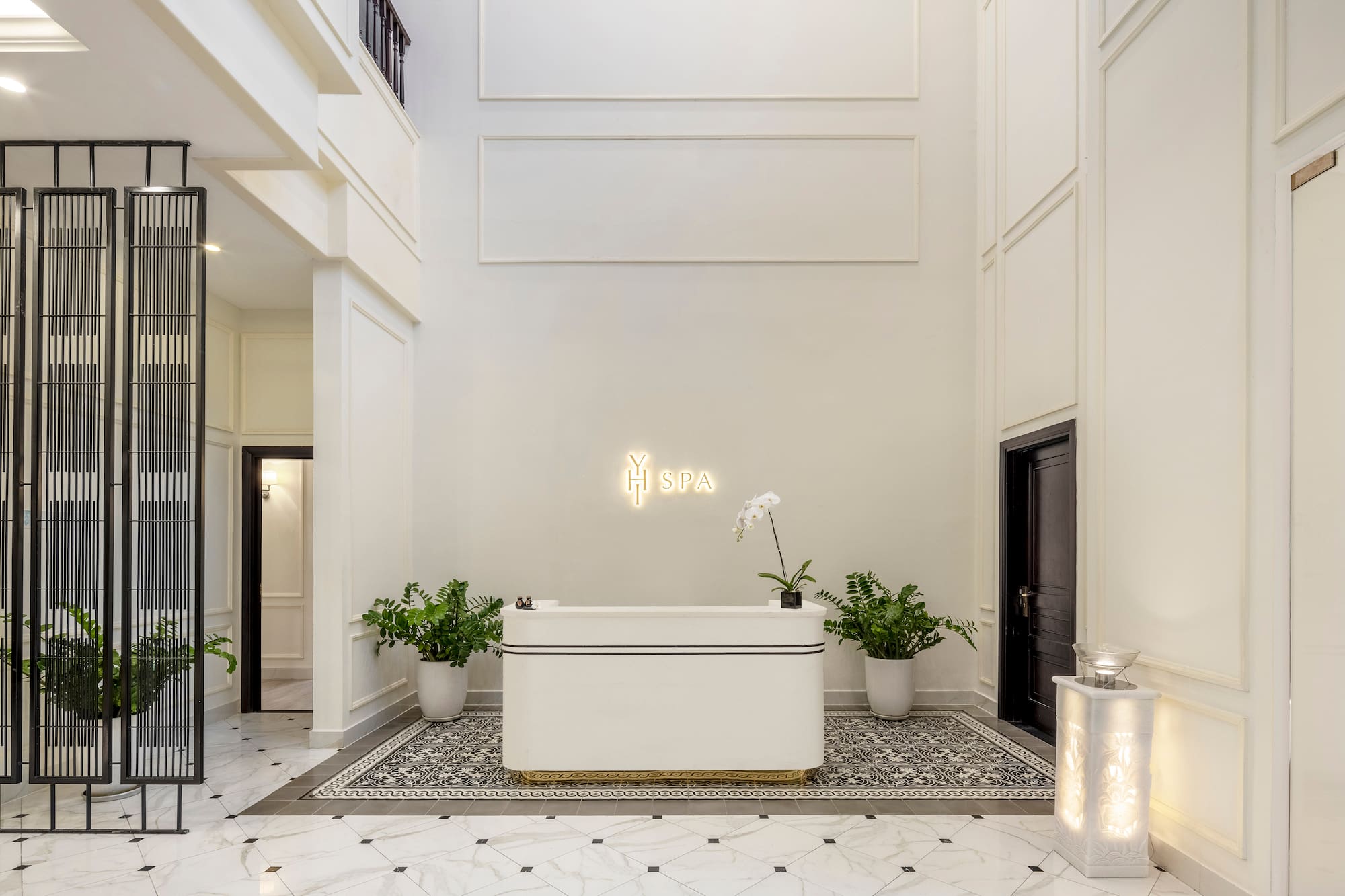 a white room with a bathtub and plants