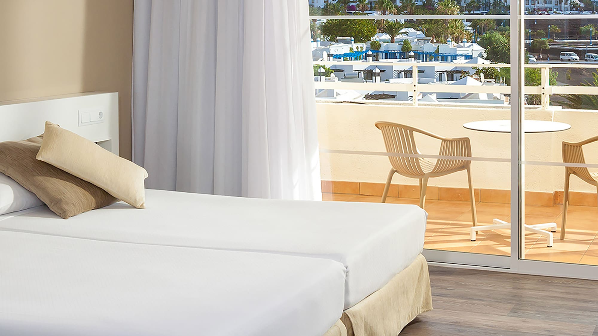 a hotel room with a view of the ocean and a balcony