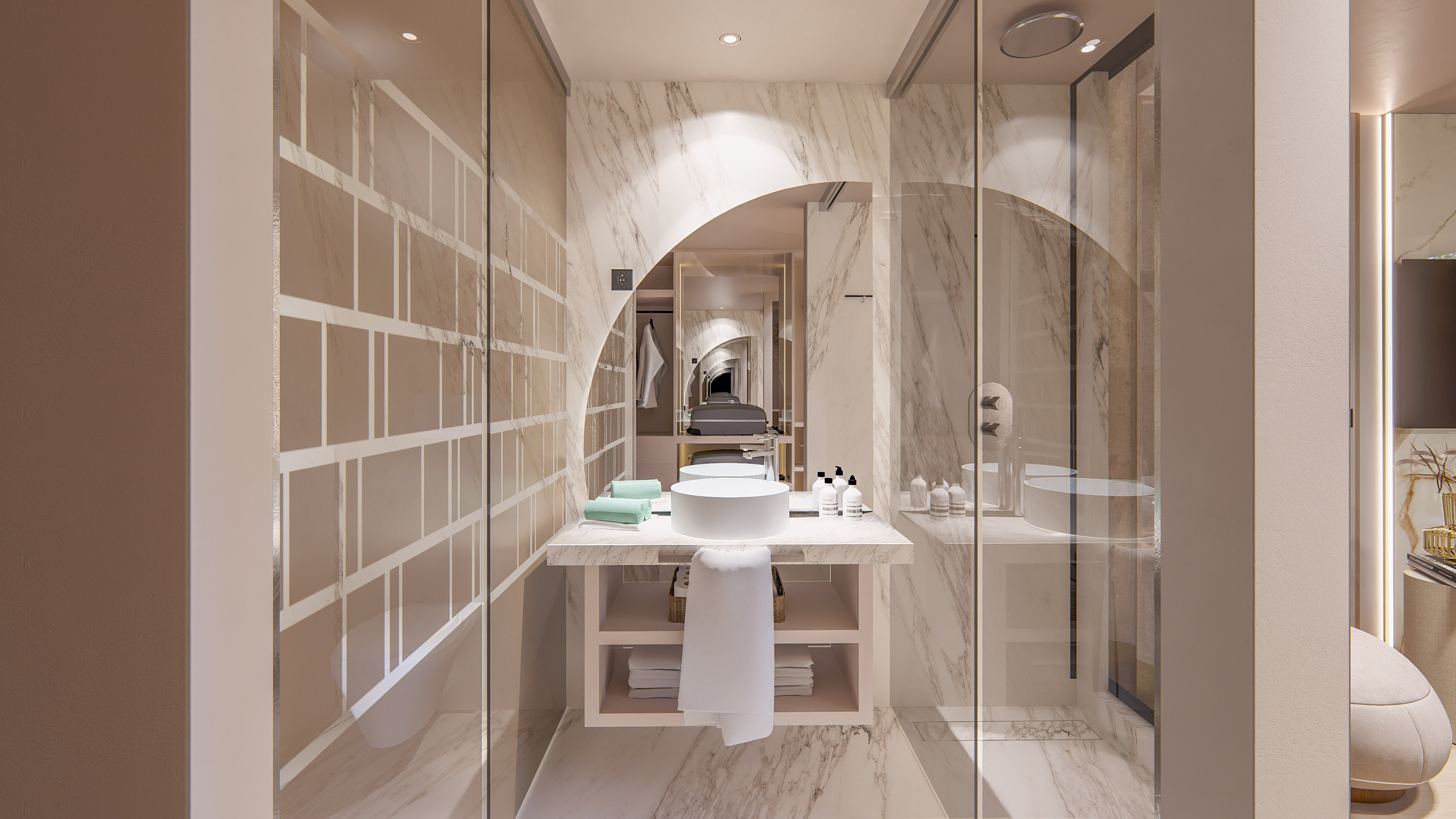 Luxury marble bathroom with circular vanity sink and glass shower enclosure.