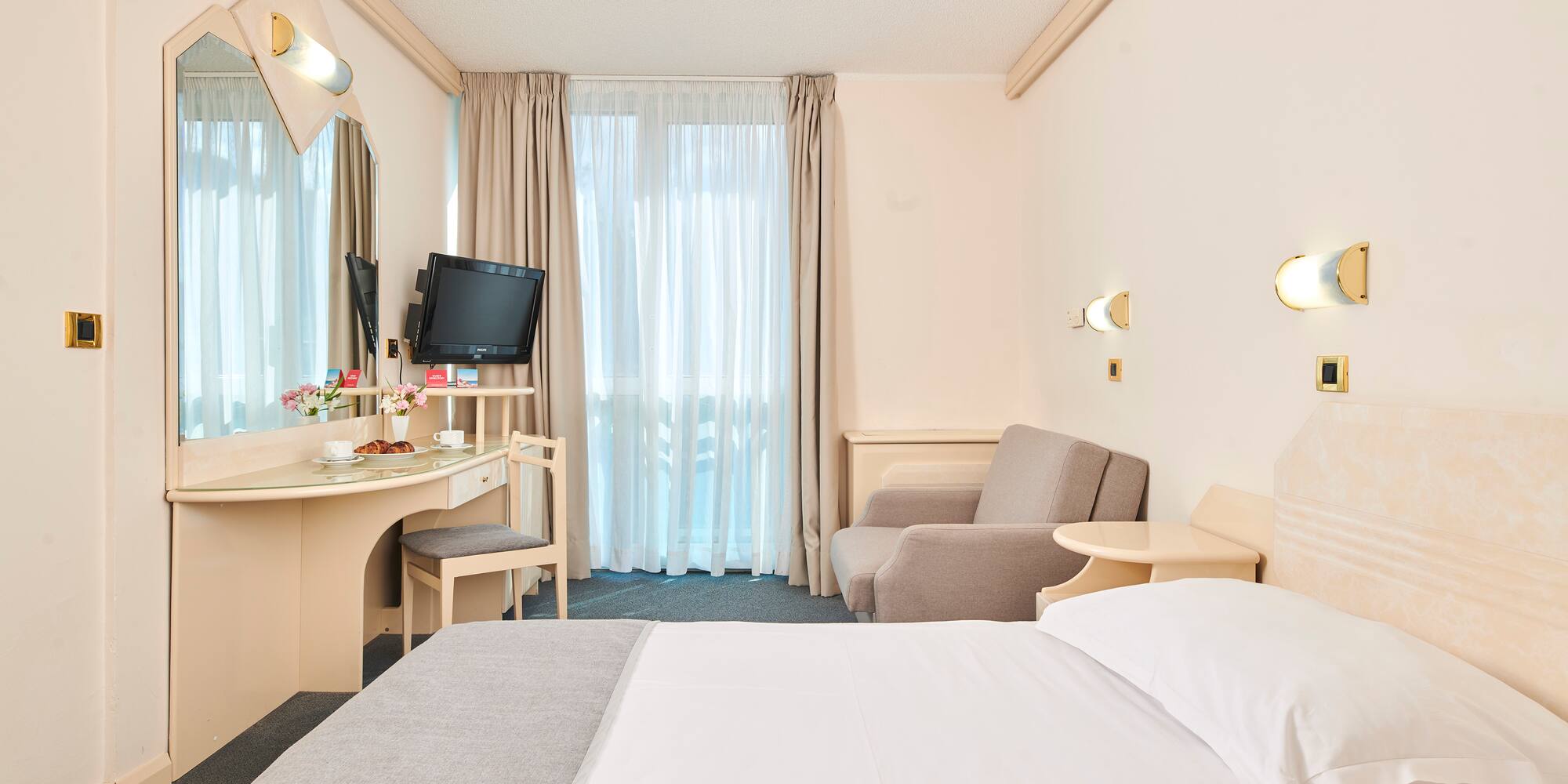 a room with a bed and a desk